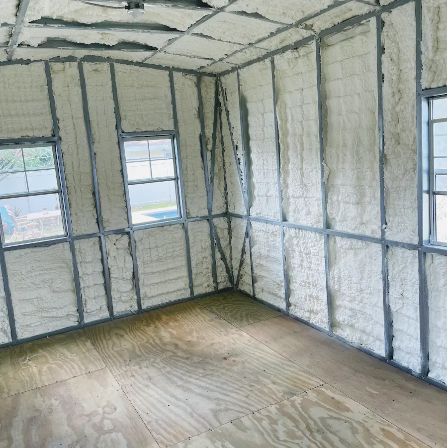 Closed-cell spray foam insulation applied to wall cavities in a residential project in Taft